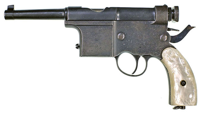 7mm Charola with receiver and bolt held open slightly by the internal mechanism, safety engaged