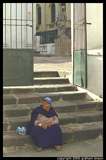 Woman on church steps in Quito